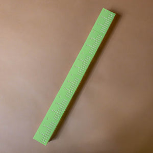 green-ruler-on-blocks