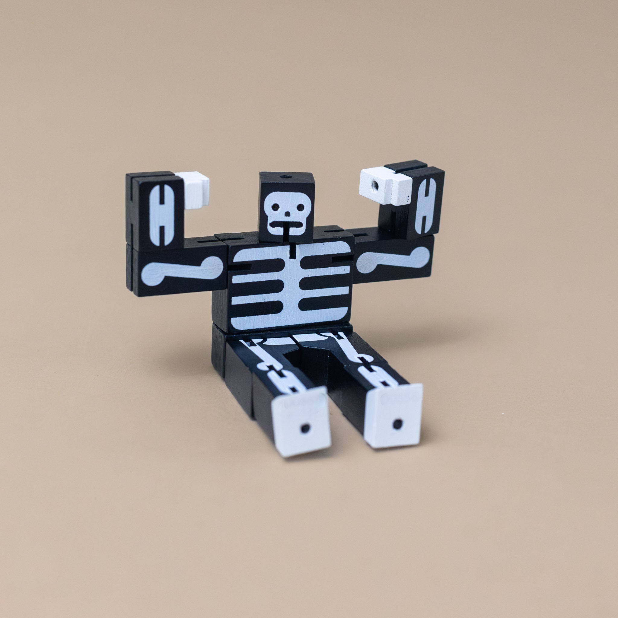 wooden-micro-cubebot-black-skeleton-sitting