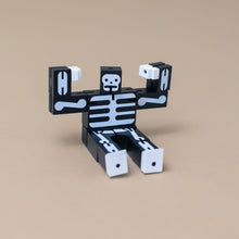 Load image into Gallery viewer, wooden-micro-cubebot-black-skeleton-sitting