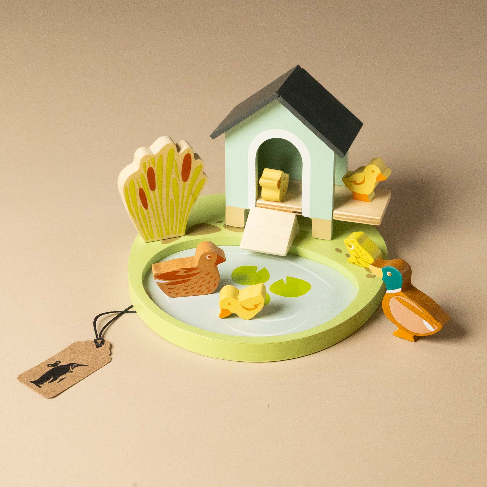 wooden-pet-play-set-duck- with toy pond with ducks and a duckhouse on a beige background