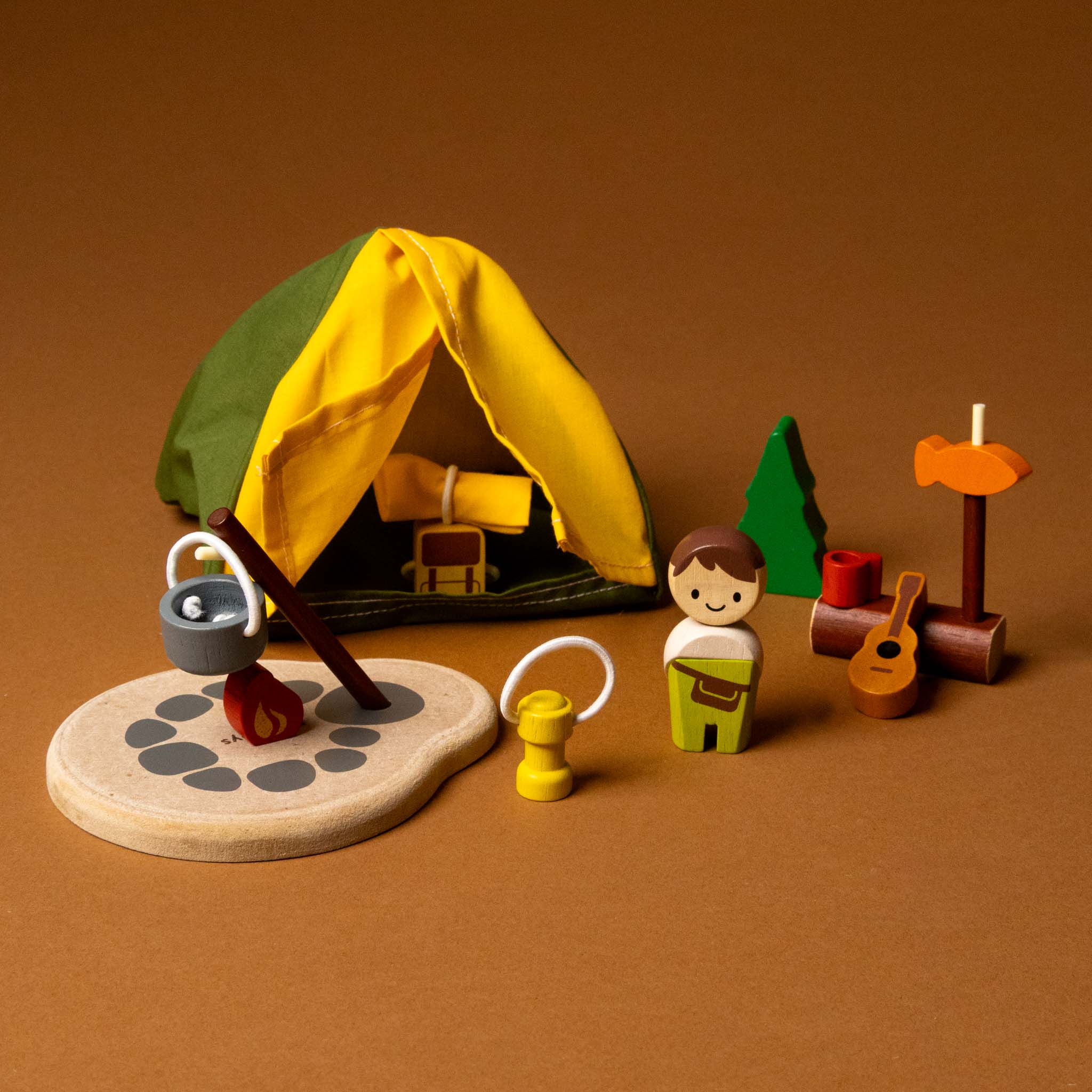 Toy camping set with a yellow tent, wooden figures, and accessories 