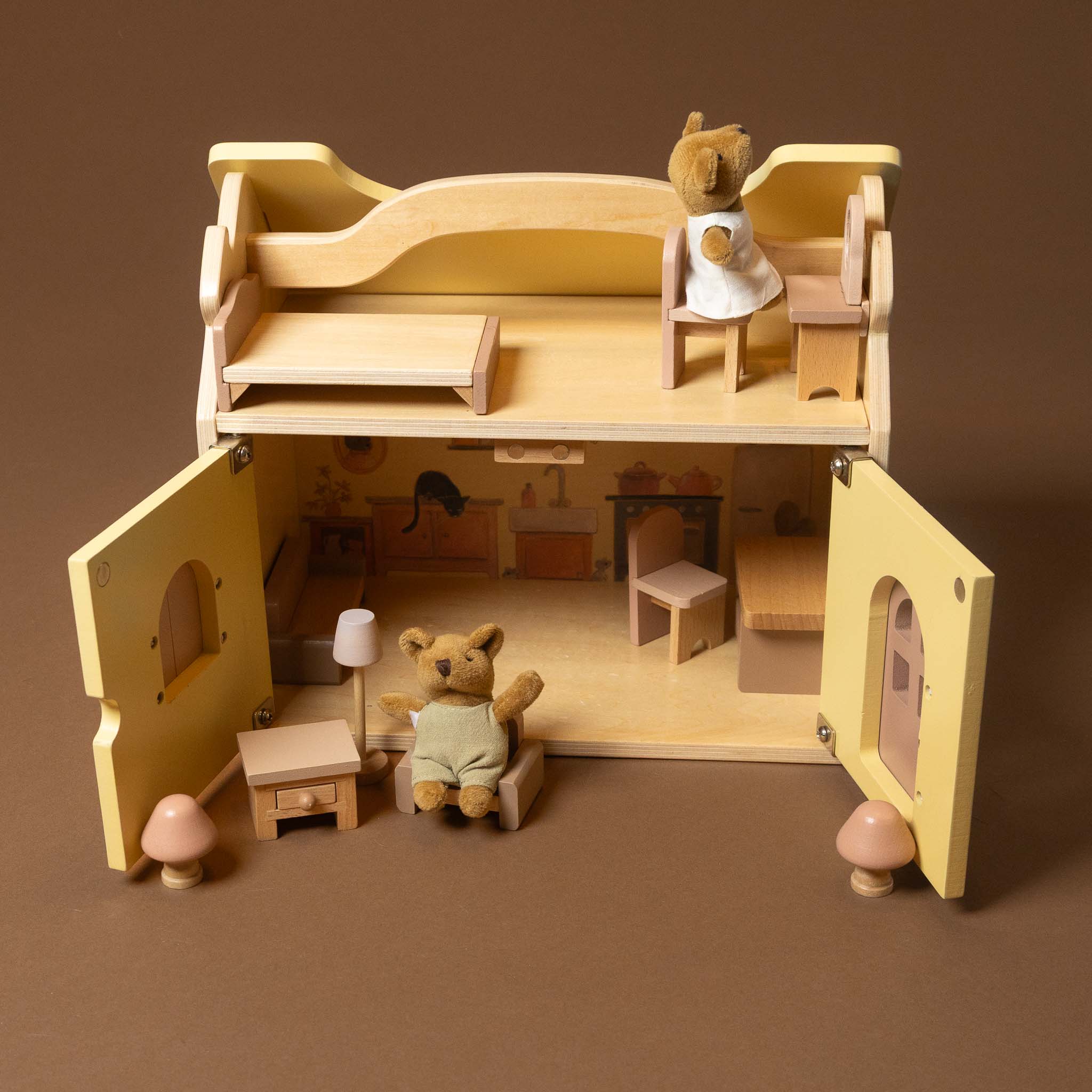 Wooden dollhouse with teddy bears on a brown background