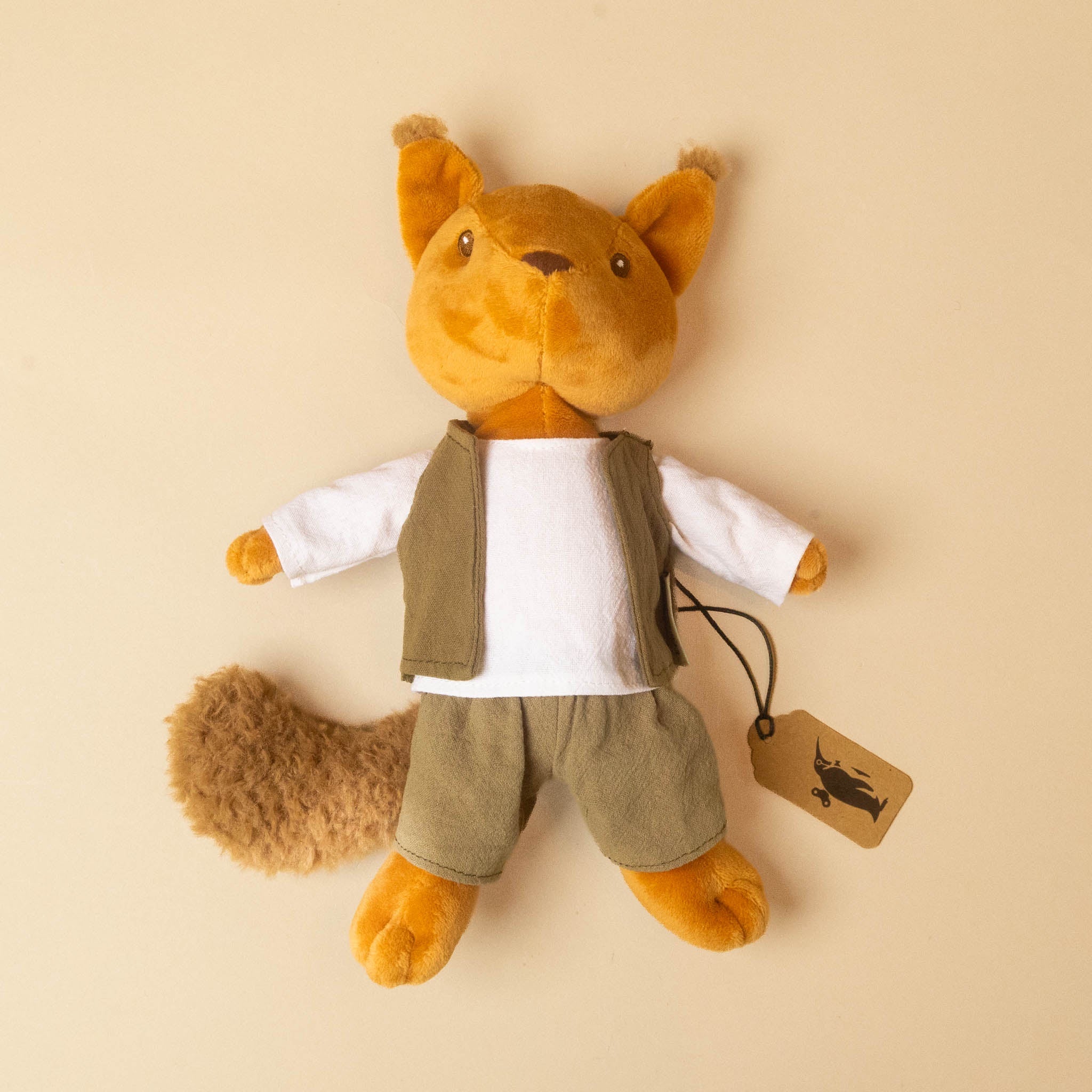 woodland-friends-squirrel-shirt-vest-and-pants laid flat on a warm beige background with a small hanging tag attached.