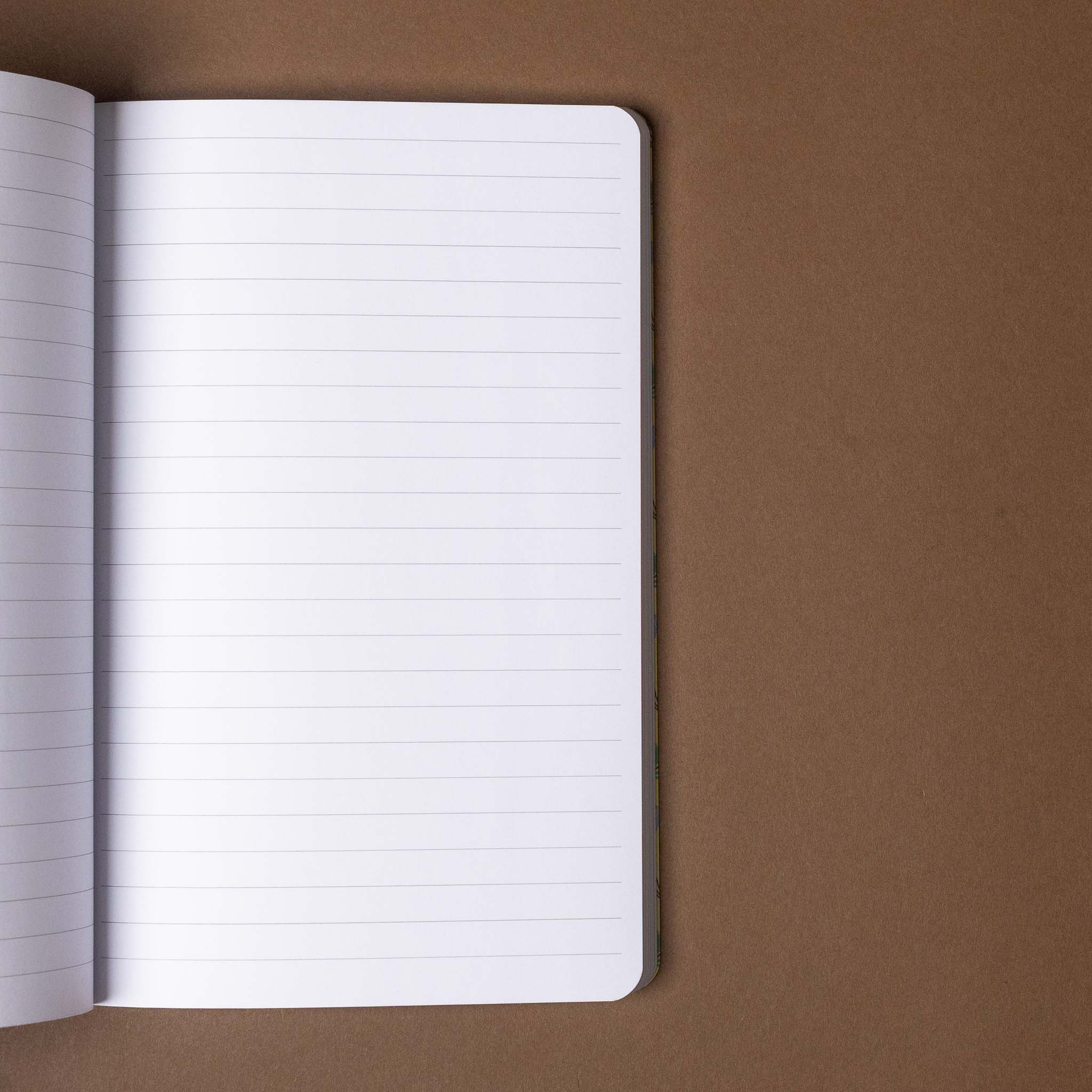 Open notebook with lined pages on a brown background