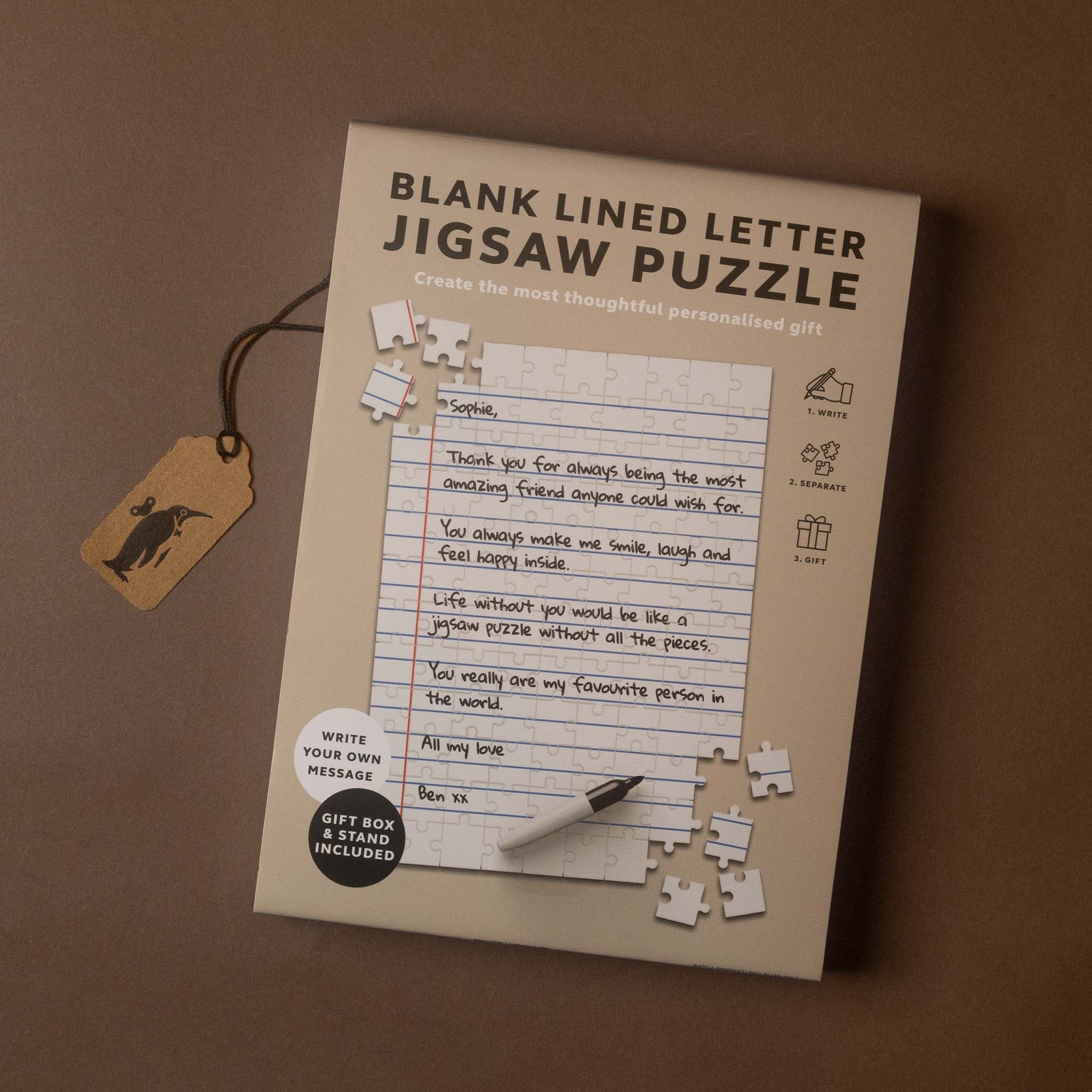 write-your-own-jigsaw-puzzle-gift-set A boxed letter jigsaw puzzle package shown on a brown surface. 