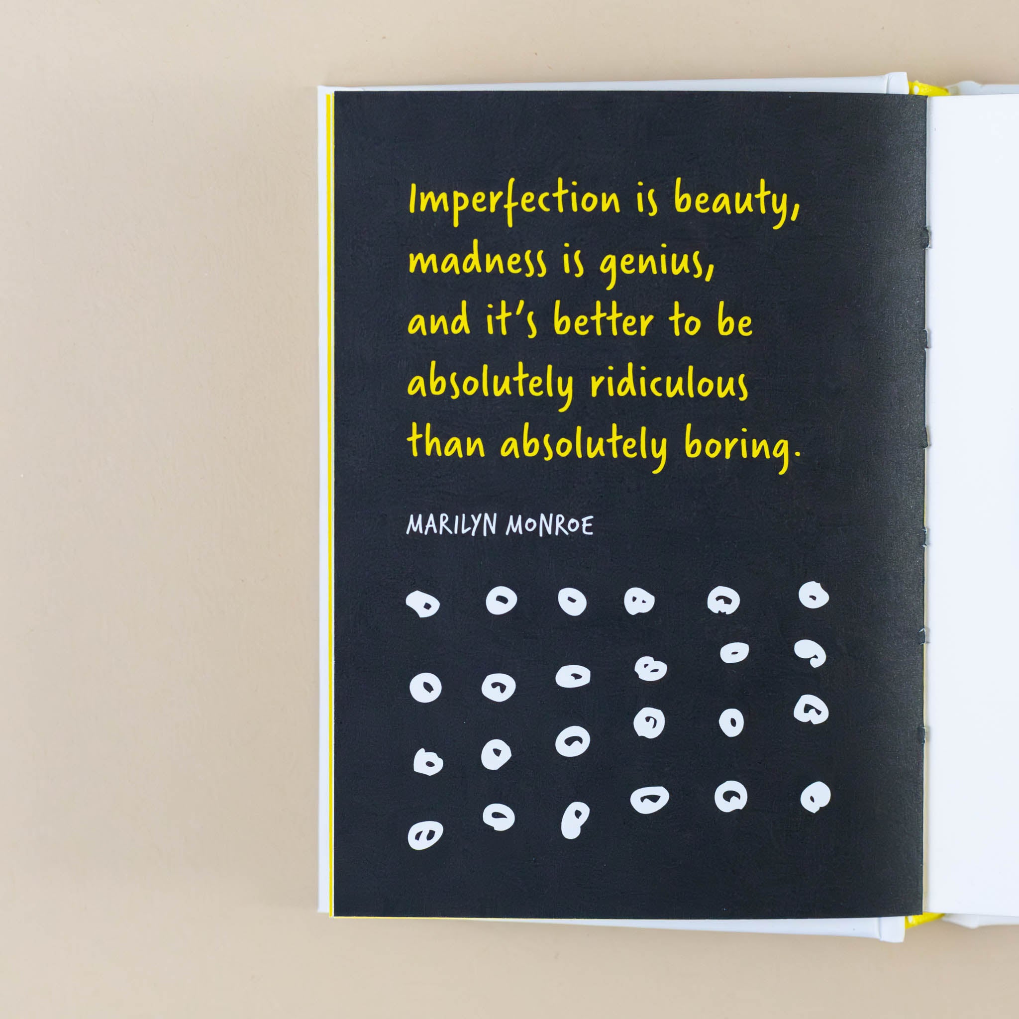 black-page-with-yellow-text-stating-imperfection-is-beauty-madness-is-genius-and-it-is-better-to-be-absoutely-ridulous-than-abslutely-boring-marilyn-monroe-with-small-imperfect-circles-below