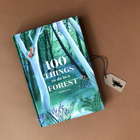 100-things-to-do-ina-forest-front-cover-woth-tree-and-squirrel-illustration
