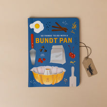 Load image into Gallery viewer, 101-things-to-do-with-a-bundt-pan-book-blue-cover-with-egg-cinnamon-sticks-cherries-rolling-pin-bundt-pan