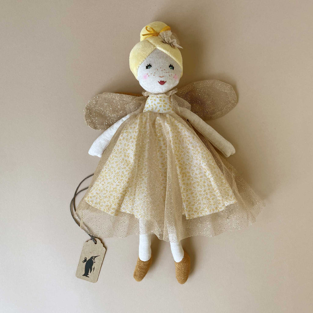 petite-fairy-doll-soleil-with-gold-tuile-dress-and-blond-hair-in-a-bun