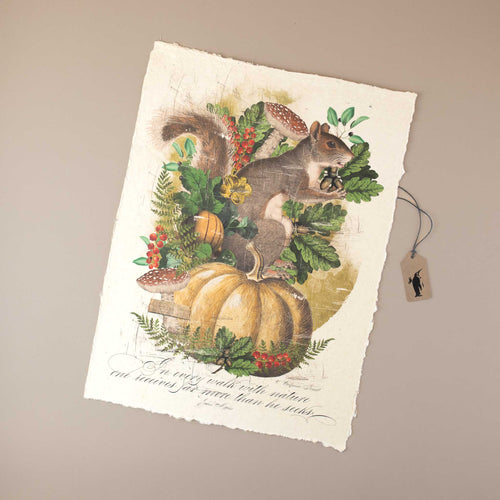 white-handmade-print-with-squirrel-holding-nuts-mushrooms-and-a-big-pumpkin