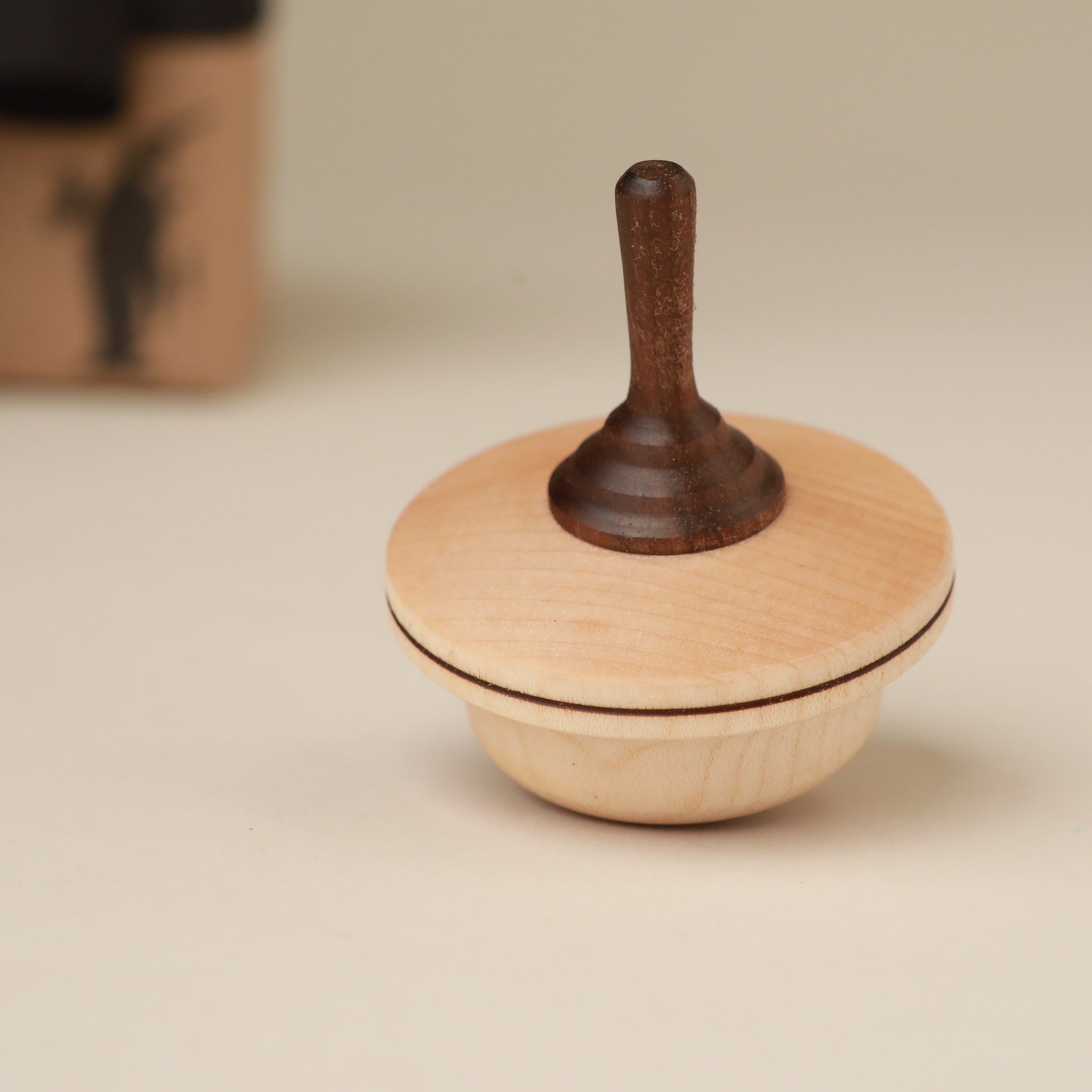 light-and-dark-wood-spinning-top