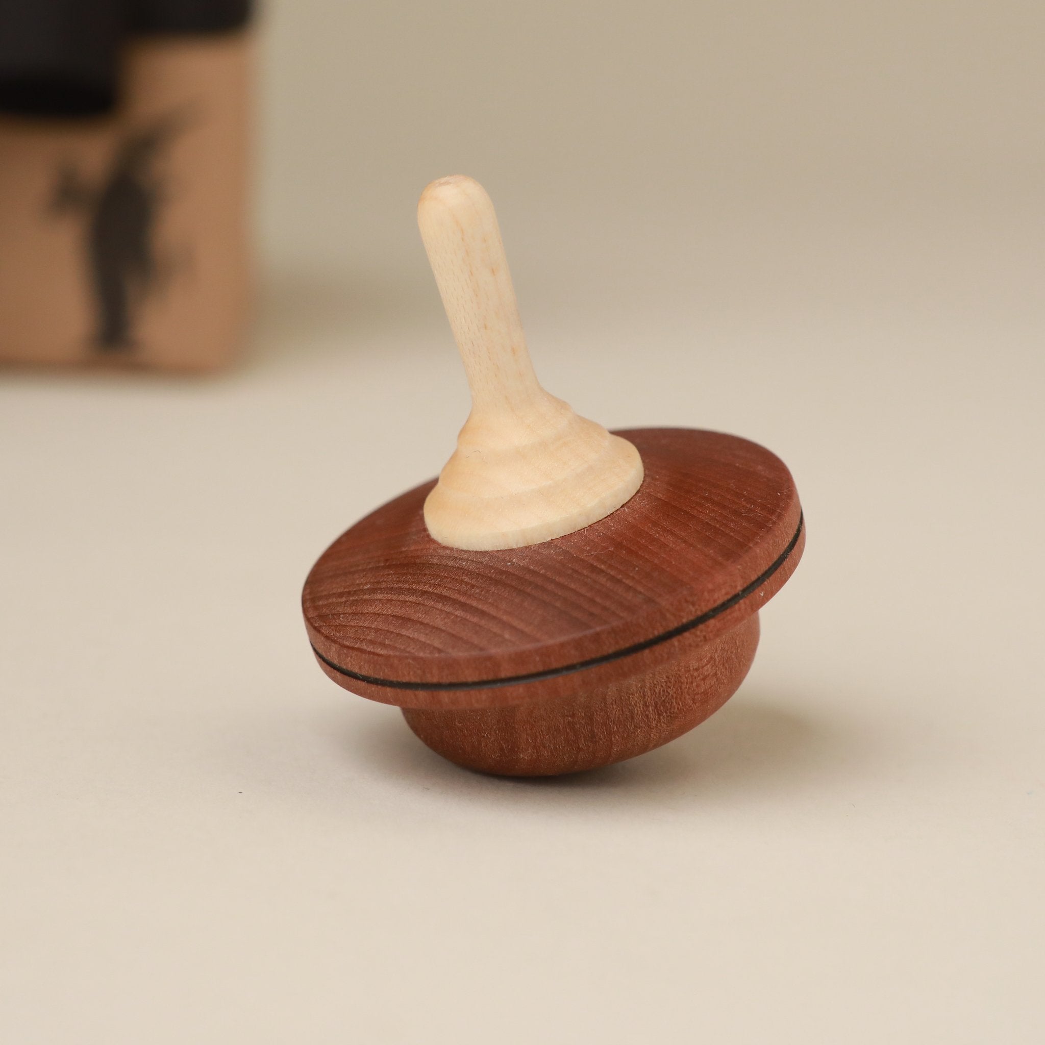 dark-and-light-wood-spinning-top