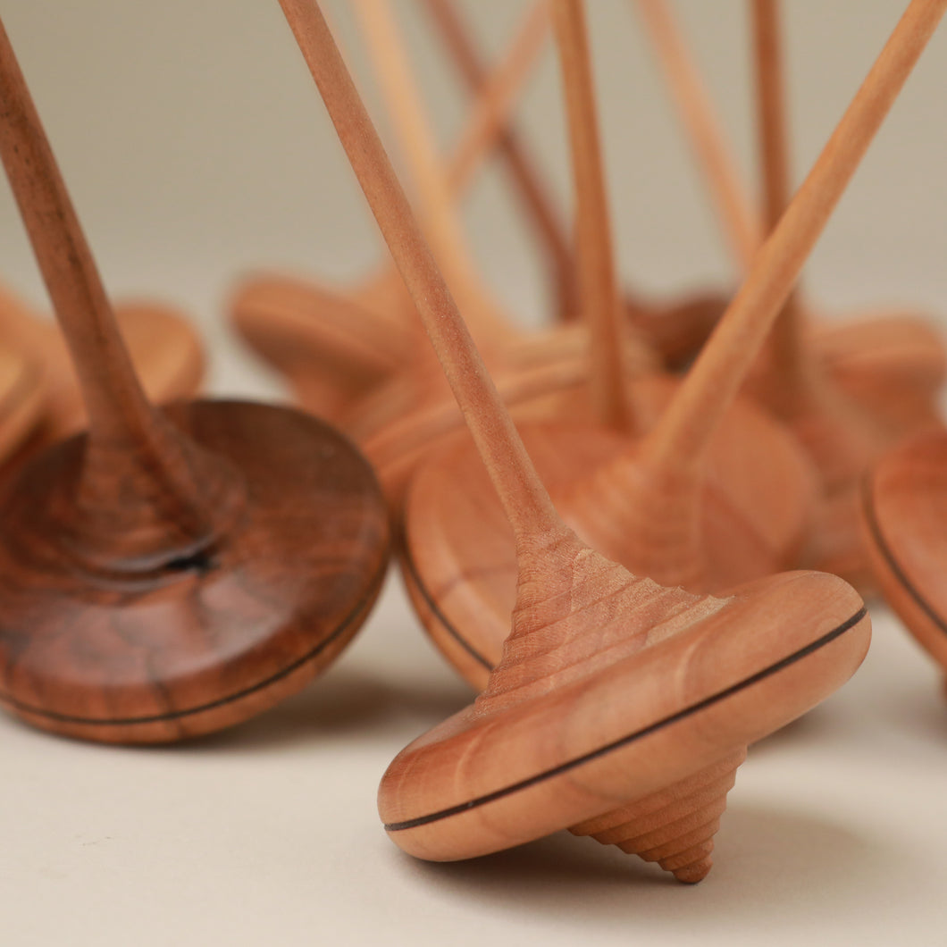 wooden-spinning-top-with-long-thin-handle