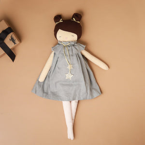 pale-cloth-doll-with-brown-hair-and-pale-blue-dress