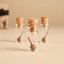 Load image into Gallery viewer, mini-wooden-spinning-tops-in-glass-jars-with-corks