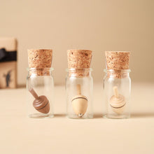 Load image into Gallery viewer, wooden-tops-in-glass-jars-with-corks