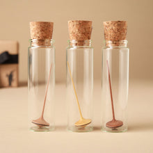 Load image into Gallery viewer, mini-wooden-spinning-top-with-long-thin-handle-in-glass-jars-with-corks