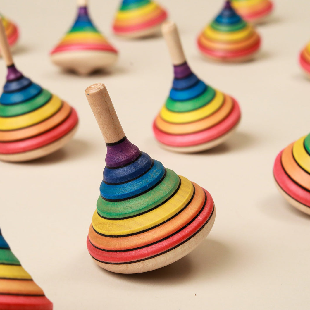 rainbow-striped-cone-shaped-wooden-spinning-tops
