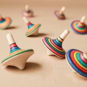 colorful-striped-wooden-spinning-tops