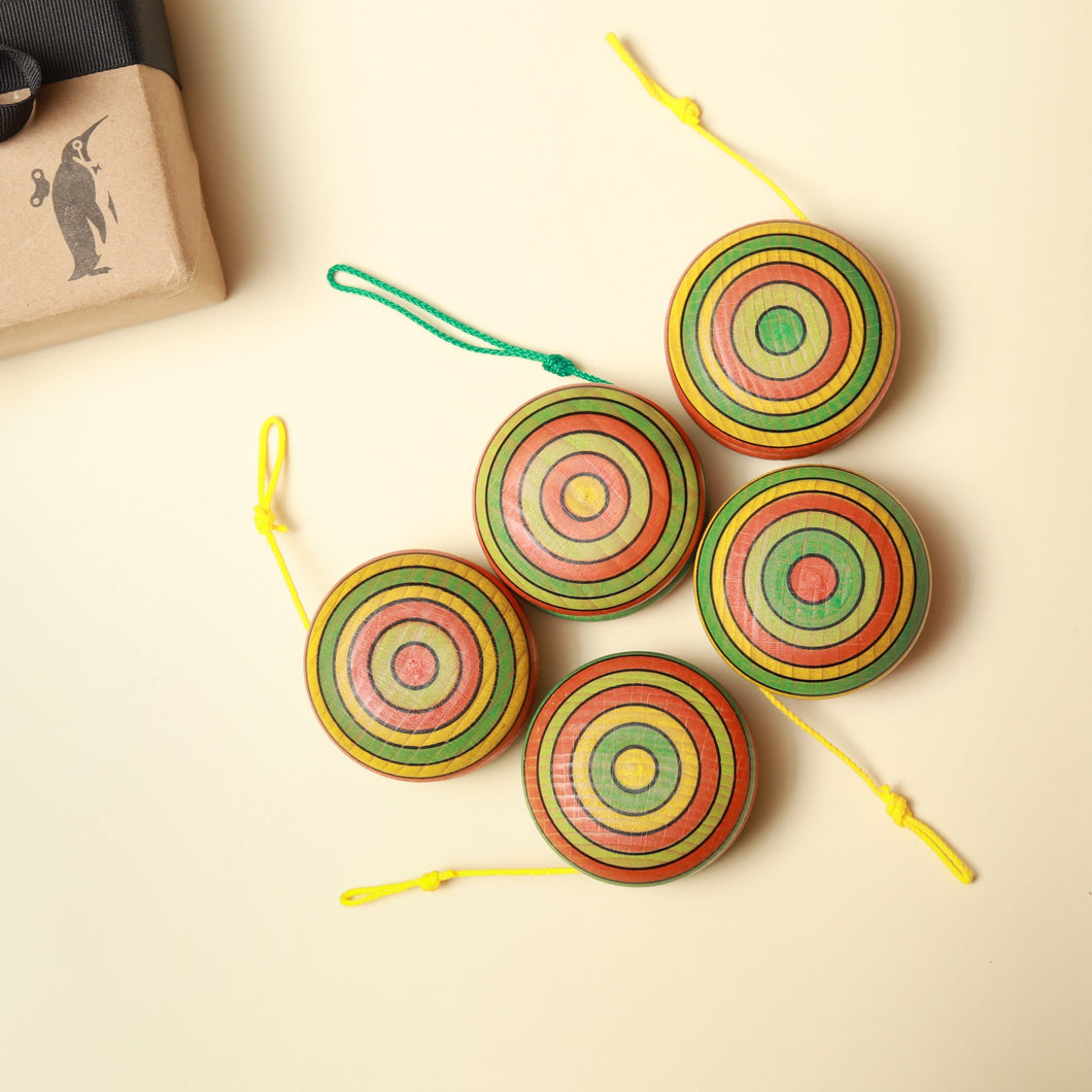 summer-colors-striped-wooden-yoyos-with-green-and-yellow-string