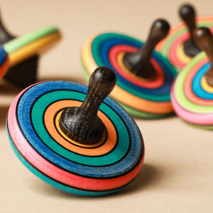 bright-rainbow-striped-tutu-spinning-top