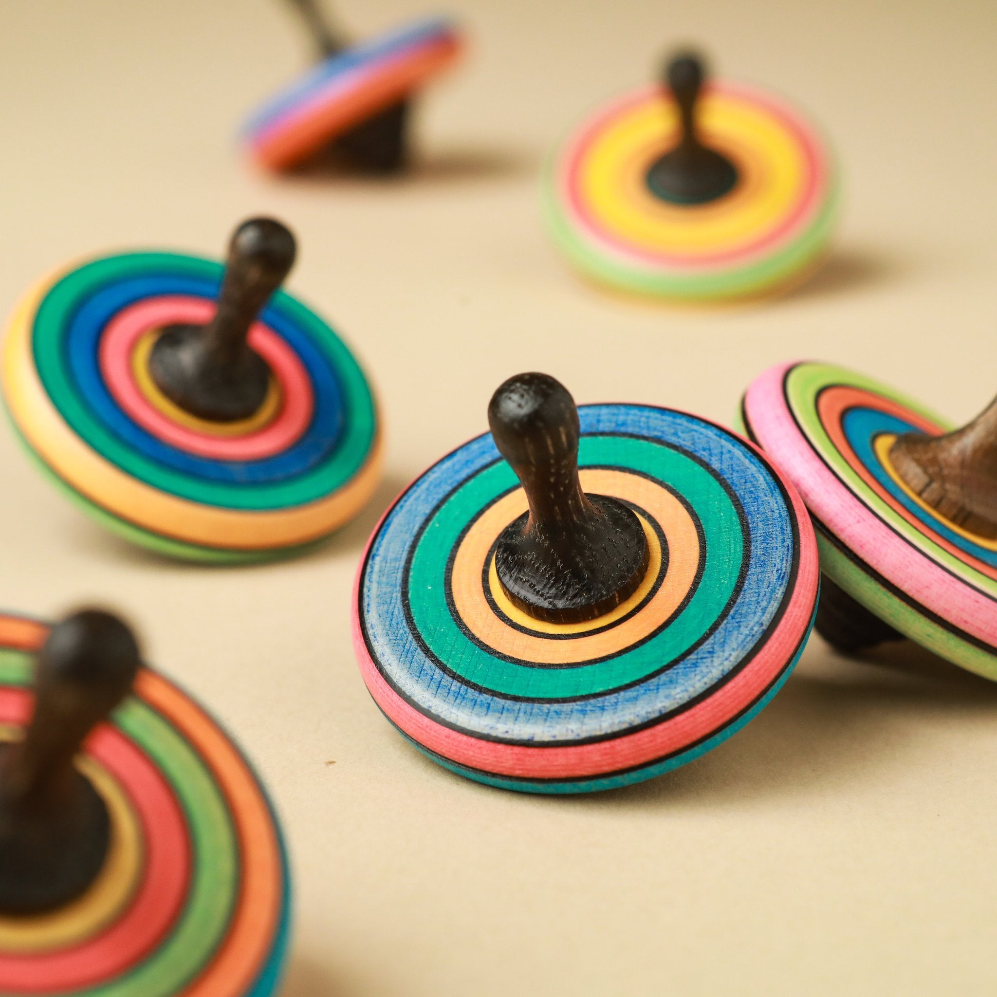 bright-rainbow-striped-tutu-spinning-tops