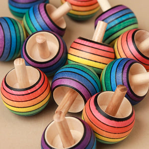 group-of-rainbow-striped-spinning-tops