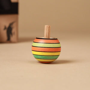 single-upside-down-spinning-top-in-summer-striped-colors