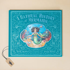 teal-with-silver-foiling-front-cover-natural-history-of-mermaids
