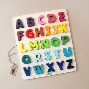 rainbow-colored-alphabet-shapes-puzzle-in-wooden-base