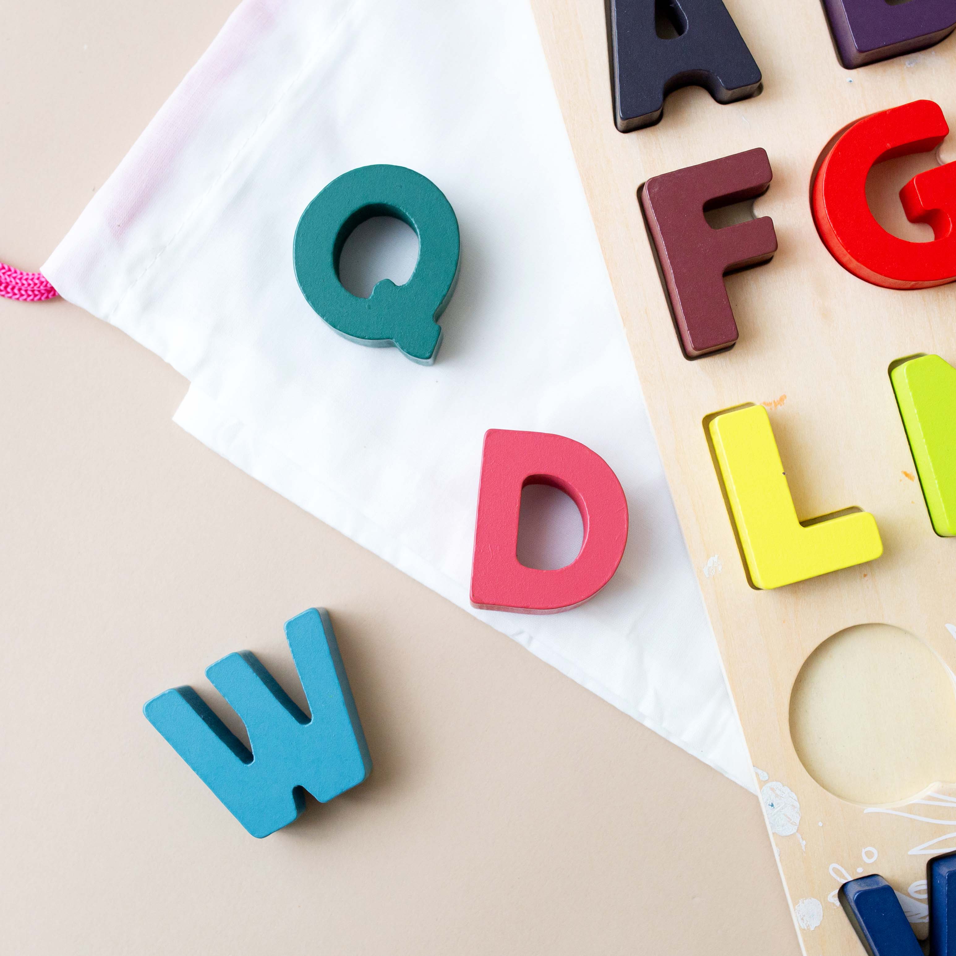 close-up-of-rainbow-color-alphabet-shape-pieces