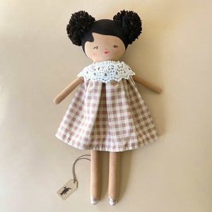 aggie-doll-with-tan-skin-rose-check-dress-and-lace-collar-and-black-pom-pom-hair