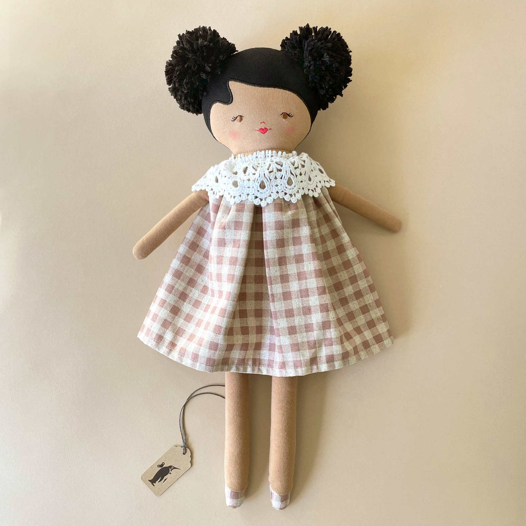 aggie-doll-with-tan-skin-rose-check-dress-and-lace-collar-and-black-pom-pom-hair