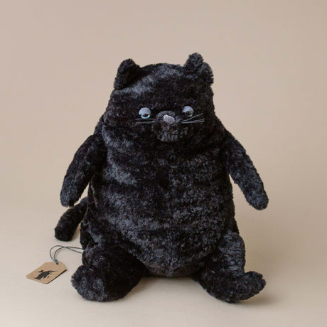 amore-cat-stuffed-animal-black-with-sleepy-looking-eyes