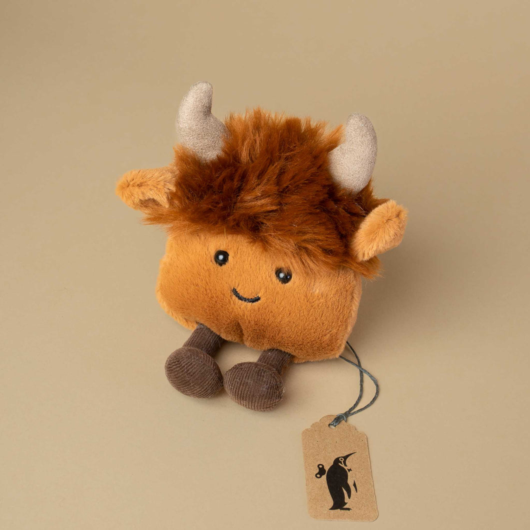 small-brown-highland-cow-wothout-arms-and-suede-like-horns-and-fluffy-hair-on-its-head