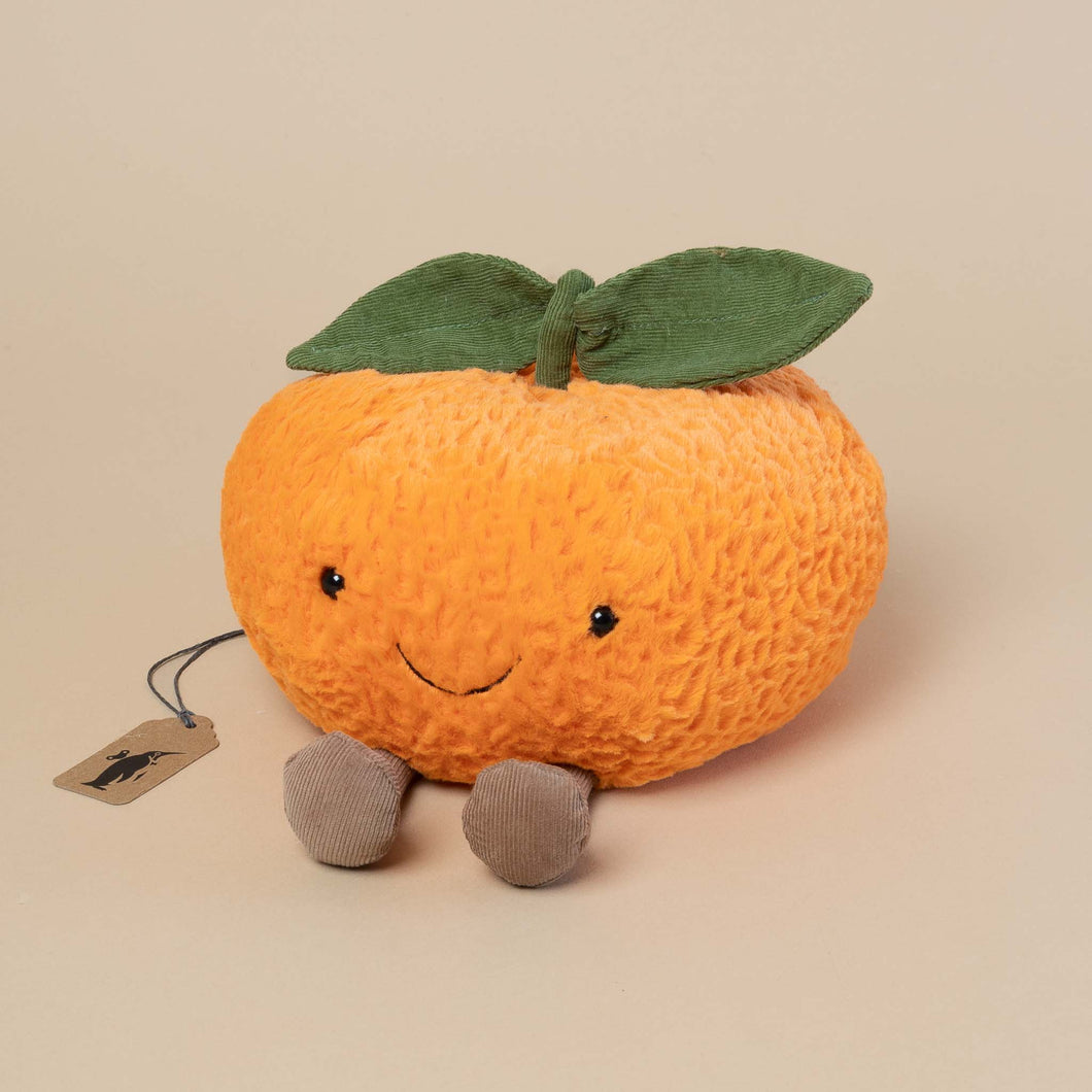 clementine-stuffed-animal-with-smiling-face-and-corduroy-feet