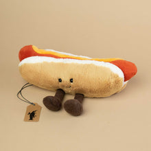 Load image into Gallery viewer, stuffed-animal-that-looks-like-a-hotdog-with-feet-and-smiley-face