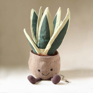 snake-plant-in-pot-stuffed-animal-with-smiling-face-and-corduroy-feet