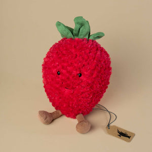 red-fluffy-strawberry-with-smiley-face-and-green-leaves-on-head