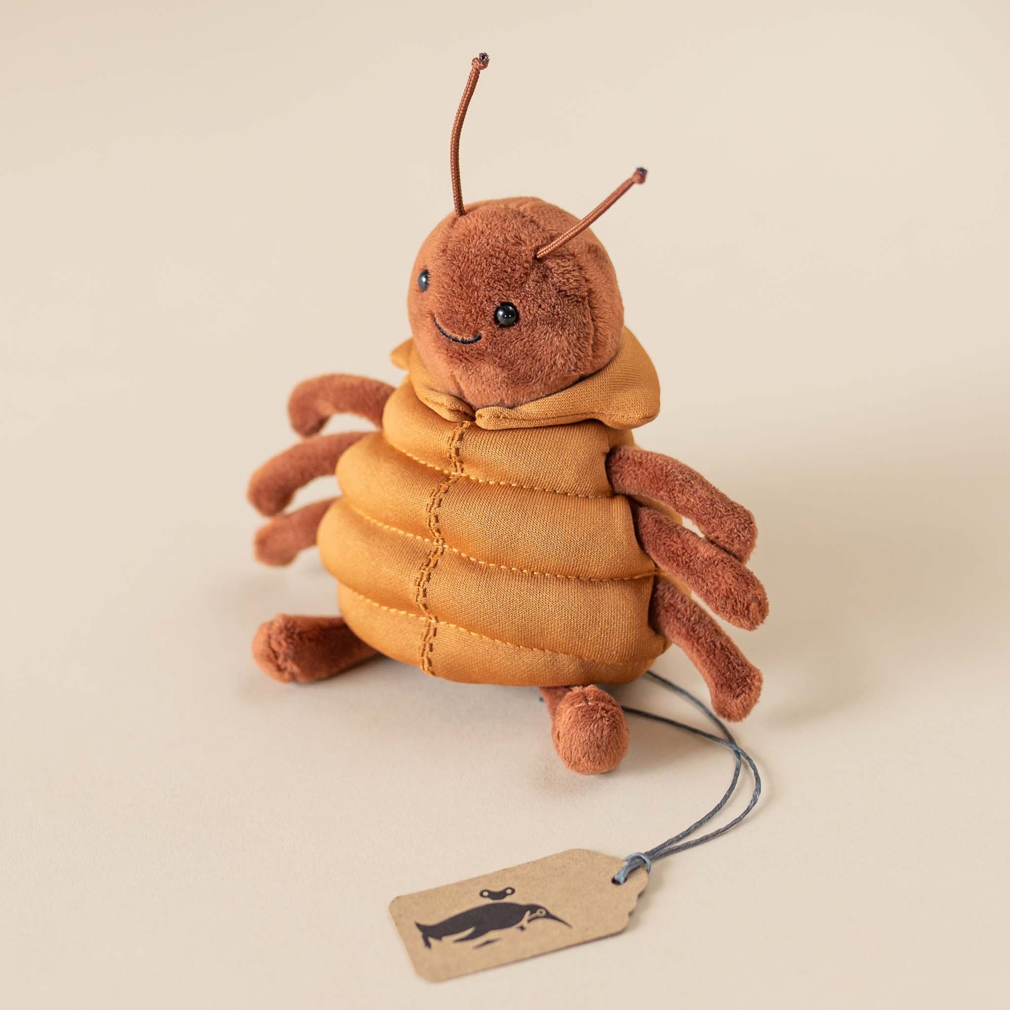 brown-spider-in-ochre-puffy-vest-stuffed-animal