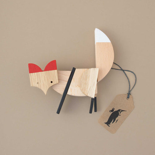 wooden-fox-with-red-ears-and-white-tail-tip-and-plag-legs-consisting-of-different-small-pieces-held-together-by-magnets