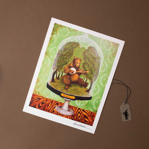 paper-print-of-bear-playing-banjo-in-glass-case