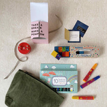 Load image into Gallery viewer, budding-artist-gift-set-all-items-outside-of-moss-green-velvet-pouch-including-a-red-button-pom-maker-thoughtfulls-cards-block-crayons-and-magic-markers