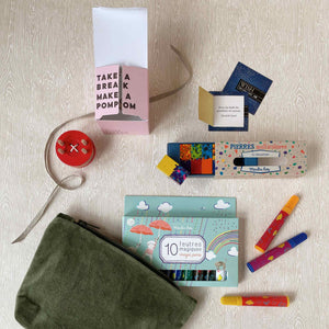 budding-artist-gift-set-all-items-outside-of-moss-green-velvet-pouch-including-a-red-button-pom-maker-thoughtfulls-cards-block-crayons-and-magic-markers