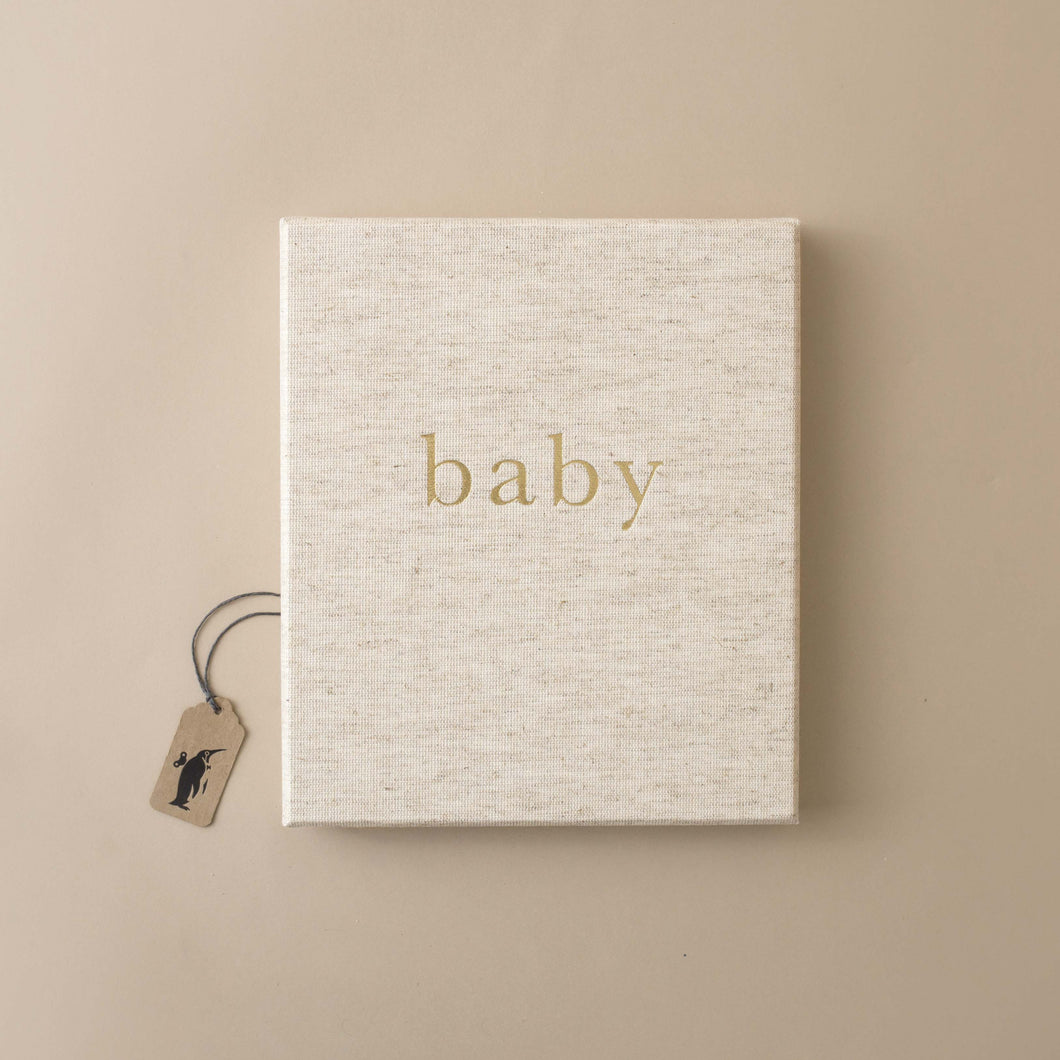 beige-cloth-covered-book-gold-word-baby
