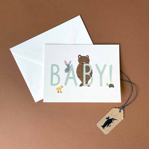 greeting-card-with-baby-in-mint-lettering-and-woodland-creatures-on-a-white-background
