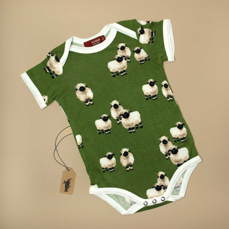 baby-onesie-with-short-sleeves-in-dark-green-with-valais-sheeps-pattern