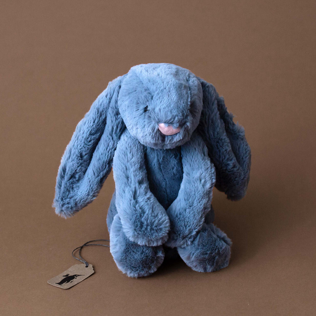 dusky-blue-bunny-stuffed-animal-in-sitting-position