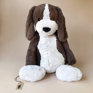 dark-brown-and-white-dog-stuffed-animal