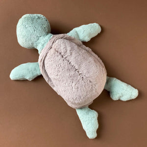 light-green-turtle-stuffed-animal-sitting-top-shell-view